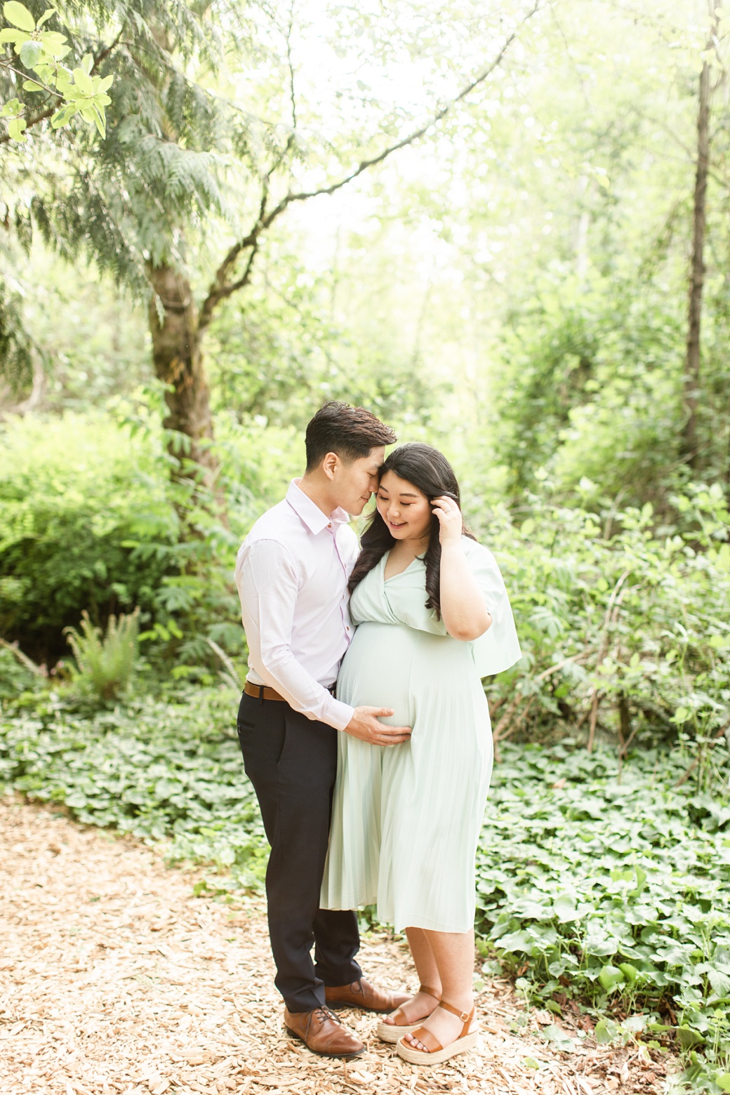 Seattle maternity session surrounded by greenery