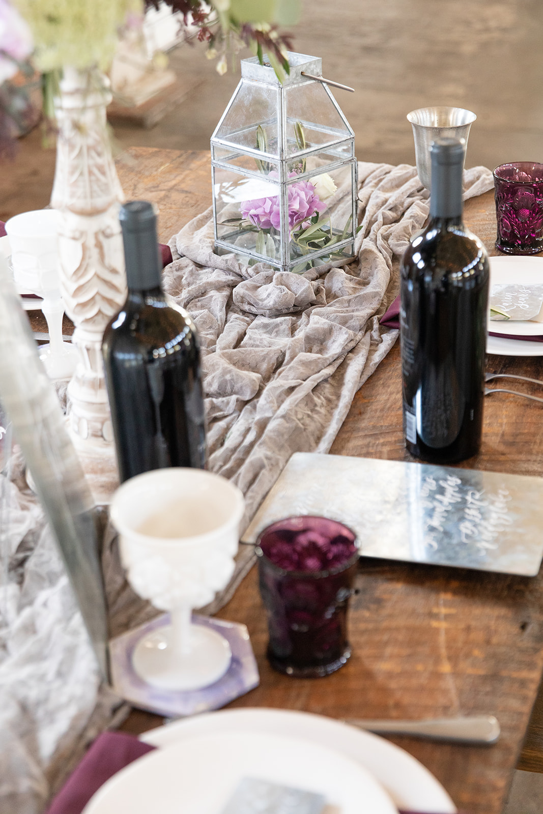 wedding reception table, wine bottles, wine goblets, menu