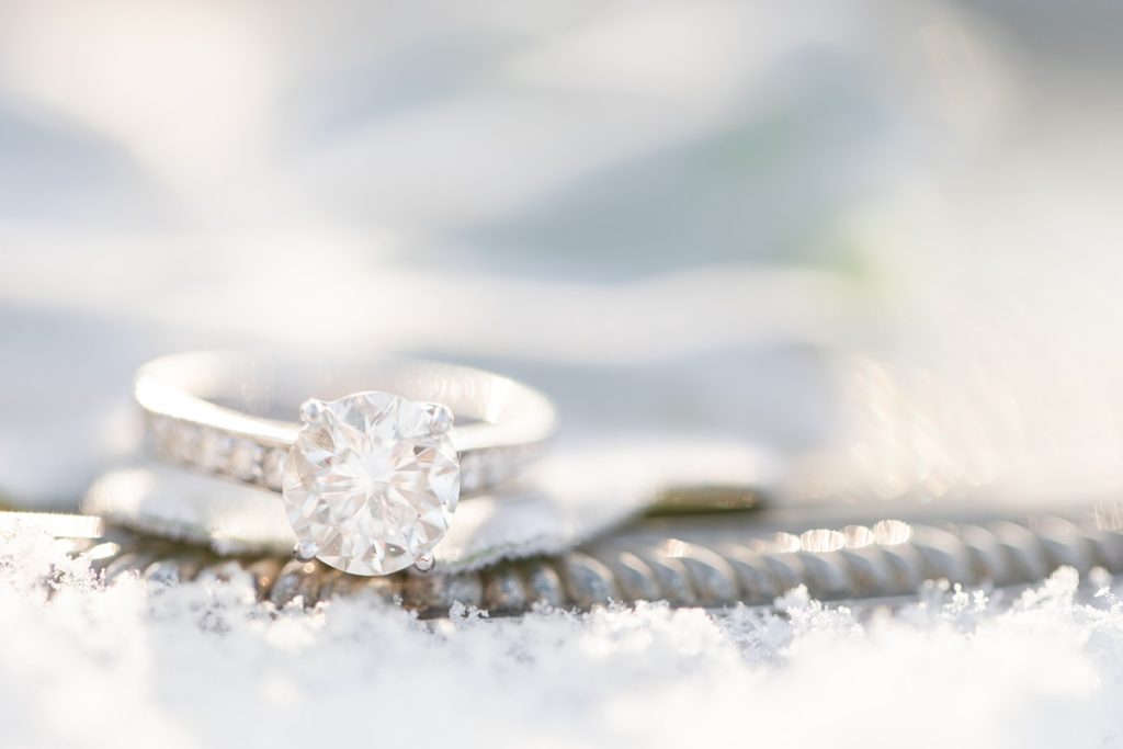 engagement ring on vintage tray in the snow