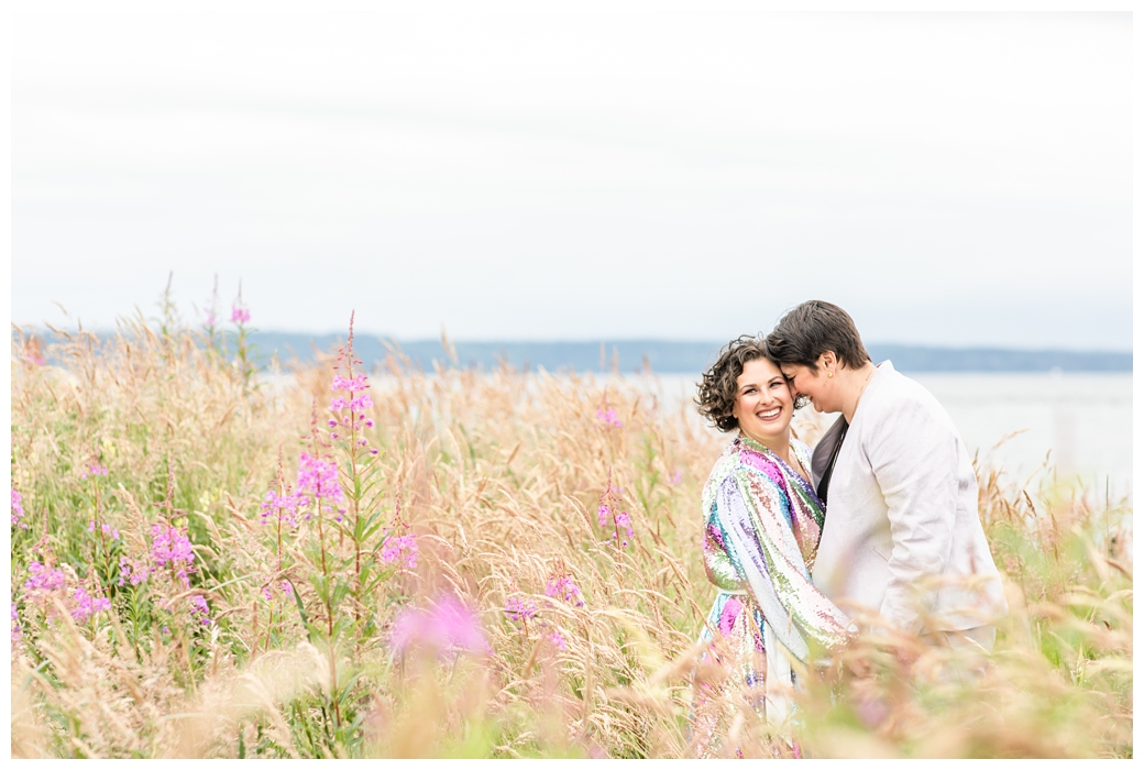 LGBTQ couple during wedding portraits in tall beach grass